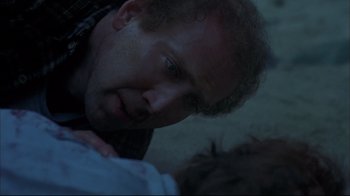 Movie still from “Adaptation.” (2002), directed by Spike Jonze – A person with a baby; Close Up shot, Over the shoulder angle
