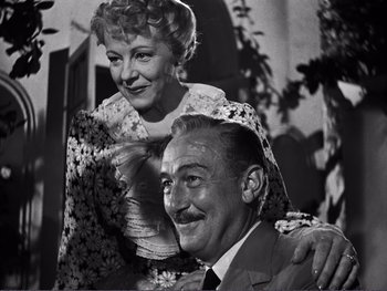 Movie still from “Address Unknown” (1944), directed by William Cameron Menzies – An old photo of an older man and a woman; Close Up shot, Low angle