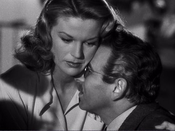 Movie still from “Address Unknown” (1944), directed by William Cameron Menzies – A man and a woman looking at one another; Close Up shot, Low angle
