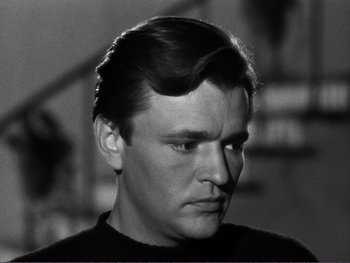 Movie still from “Address Unknown” (1944), directed by William Cameron Menzies – A black and white photo of a man with a mustache; Close Up shot, Low angle