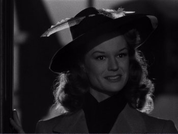Movie still from “Address Unknown” (1944), directed by William Cameron Menzies – A black and white photo of a woman wearing a hat; Close Up shot, Low angle
