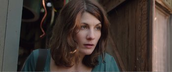 Movie still from “Adult Life Skills” (2016), directed by Rachel Tunnard – A person with long brown hair; Close Up shot, High angle