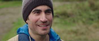 Movie still from “Adult Life Skills” (2016), directed by Rachel Tunnard – A person wearing a hat; Close Up shot, Over the shoulder angle