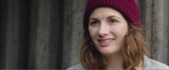 Movie still from “Adult Life Skills” (2016), directed by Rachel Tunnard – A person wearing a hat; Close Up shot, Over the shoulder angle