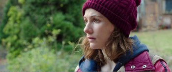 Movie still from “Adult Life Skills” (2016), directed by Rachel Tunnard – A person wearing a hat; Close Up shot, Over the shoulder angle