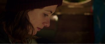 Movie still from “Adult Life Skills” (2016), directed by Rachel Tunnard – A person wearing a hat; Close Up shot, Over the shoulder angle