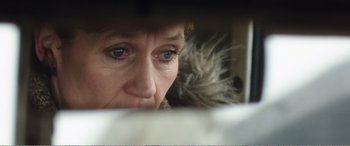 Movie still from “Adult Life Skills” (2016), directed by Rachel Tunnard – A person looking at a camera; Extreme Close Up shot, Low angle