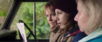 Movie still from “Adult Life Skills” (2016), directed by Rachel Tunnard – Two women are standing next to each other in a bus; Close Up shot, Over the shoulder angle