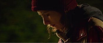 Movie still from “Adult Life Skills” (2016), directed by Rachel Tunnard – A person wearing a hat; Close Up shot, Low angle