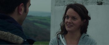 Movie still from “Adult Life Skills” (2016), directed by Rachel Tunnard – A person with long brown hair; Close Up shot, Over the shoulder angle