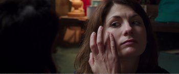 Movie still from “Adult Life Skills” (2016), directed by Rachel Tunnard – A person holding their hand up to their face; Close Up shot, Over the shoulder angle