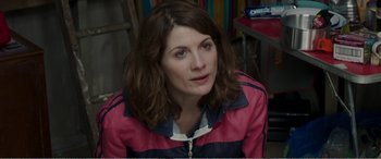Movie still from “Adult Life Skills” (2016), directed by Rachel Tunnard – A person wearing a pink jacket; Close Up shot, Over the shoulder angle