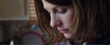 Movie still from “Adult Life Skills” (2016), directed by Rachel Tunnard – A woman's face with her eyes closed; Extreme Close Up shot, Low angle