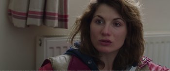Movie still from “Adult Life Skills” (2016), directed by Rachel Tunnard – A person wearing a jacket; Close Up shot, Over the shoulder angle