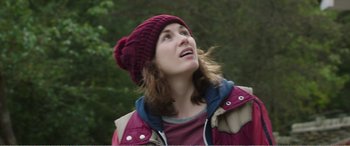 Movie still from “Adult Life Skills” (2016), directed by Rachel Tunnard – A woman wearing a hat looking up into the sky; Close Up shot, Low angle