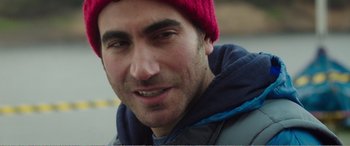Movie still from “Adult Life Skills” (2016), directed by Rachel Tunnard – A person wearing a red hat; Close Up shot, Over the shoulder angle