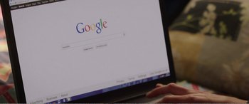 Movie still from “Adult Life Skills” (2016), directed by Rachel Tunnard – A person using a computer with a google search page on the screen; Extreme Close Up shot, High angle