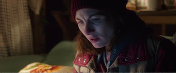 Movie still from “Adult Life Skills” (2016), directed by Rachel Tunnard – A person wearing a hat; Close Up shot, Over the shoulder angle