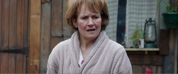 Movie still from “Adult Life Skills” (2016), directed by Rachel Tunnard – A person wearing a bathrobe; Close Up shot, High angle