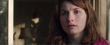 Movie still from “Adult Life Skills” (2016), directed by Rachel Tunnard – A person with long hair; Close Up shot, Over the shoulder angle