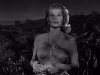 Movie still from “Affair in Trinidad” (1952), directed by Vincent Sherman – A black - and - white photo of a woman in a strapless dress; Close Up shot, Low angle