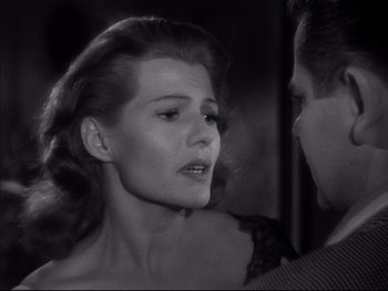 Movie still from “Affair in Trinidad” (1952), directed by Vincent Sherman – A man and a woman looking at one another; Close Up shot, Over the shoulder angle