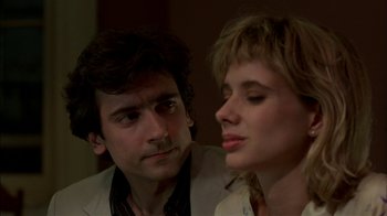Movie still from “After Hours” (1985), directed by Martin Scorsese – A man and a woman looking at each other in a room; Close Up shot, Over the shoulder angle
