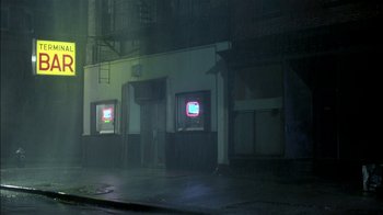 Movie still from “After Hours” (1985), directed by Martin Scorsese – A building that has a television on the outside of it; Extreme Wide shot, High angle