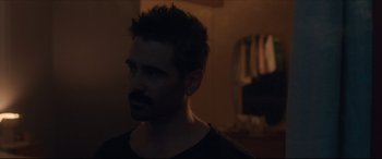 Movie still from “After Yang” (2021), directed by Kogonada – A person wearing a black shirt; Close Up shot, Over the shoulder angle