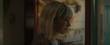 Movie still from “After Yang” (2021), directed by Kogonada – A person with blonde hair; Close Up shot, Over the shoulder angle