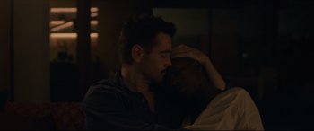 Movie still from “After Yang” (2021), directed by Kogonada – A man with his hand on his head and another man with his hand on his face; Close Up shot, High angle