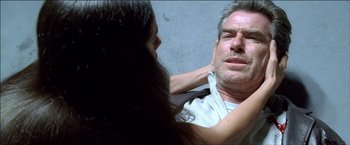 Movie still from “After the Sunset” (2004), directed by Brett Ratner – A man and a woman looking in the same mirror; Close Up shot, Overhead angle