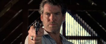 Movie still from “After the Sunset” (2004), directed by Brett Ratner – A person holding a gun; Close Up shot, Low angle