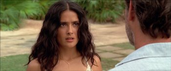 Movie still from “After the Sunset” (2004), directed by Brett Ratner – A person with long black hair; Close Up shot, Over the shoulder angle