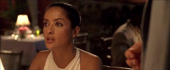 Movie still from “After the Sunset” (2004), directed by Brett Ratner – A person wearing a white shirt; Close Up shot, Over the shoulder angle