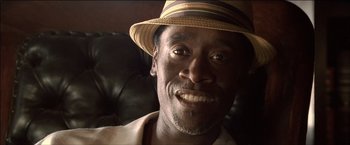 Movie still from “After the Sunset” (2004), directed by Brett Ratner – A person wearing a hat; Close Up shot, Low angle