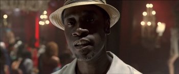 Movie still from “After the Sunset” (2004), directed by Brett Ratner – A person wearing a hat; Close Up shot, Low angle