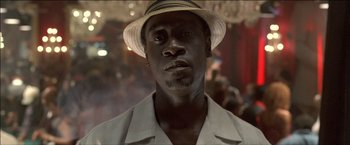 Movie still from “After the Sunset” (2004), directed by Brett Ratner – A person wearing a hat; Close Up shot, Low angle