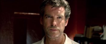 Movie still from “After the Sunset” (2004), directed by Brett Ratner – A person wearing a white shirt; Close Up shot, Low angle