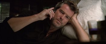 Movie still from “After the Sunset” (2004), directed by Brett Ratner – A person talking on a cell phone; Close Up shot, Overhead angle