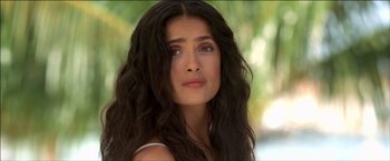 Movie still from “After the Sunset” (2004), directed by Brett Ratner – A person with long black hair; Close Up shot, Over the shoulder angle