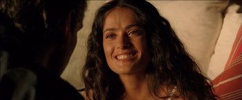 Movie still from “After the Sunset” (2004), directed by Brett Ratner – A person with a smile on their face; Close Up shot, Over the shoulder angle