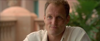 Movie still from “After the Sunset” (2004), directed by Brett Ratner – A person wearing a white shirt; Close Up shot, Low angle