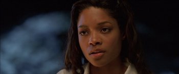 Movie still from “After the Sunset” (2004), directed by Brett Ratner – A person wearing a white shirt; Close Up shot, Low angle