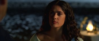 Movie still from “After the Sunset” (2004), directed by Brett Ratner – A beautiful young woman with long dark brown hair; Close Up shot, Over the shoulder angle