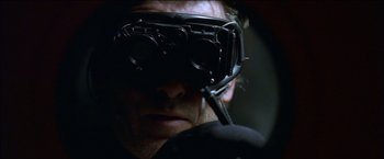 Movie still from “After the Sunset” (2004), directed by Brett Ratner – A person wearing a pair of goggles; Extreme Close Up shot, Over the shoulder angle