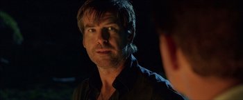 Movie still from “After the Sunset” (2004), directed by Brett Ratner – A person wearing a black shirt; Close Up shot, Over the shoulder angle