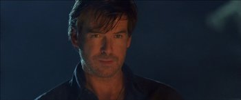 Movie still from “After the Sunset” (2004), directed by Brett Ratner – A person wearing a black shirt; Close Up shot, Over the shoulder angle