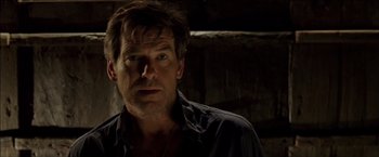 Movie still from “After the Sunset” (2004), directed by Brett Ratner – A person wearing a black shirt; Close Up shot, Over the shoulder angle