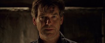 Movie still from “After the Sunset” (2004), directed by Brett Ratner – A person wearing a black shirt; Close Up shot, Over the shoulder angle